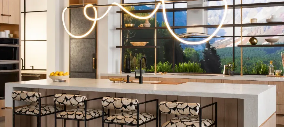 photo of a kitchen with a neon-style loop-de-loop light over the kitchen island
